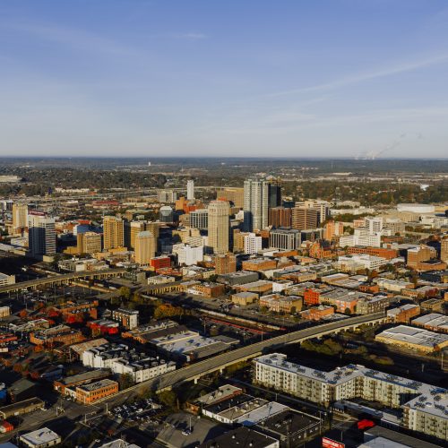 Aerial photograph showcasing Birmingham, Alabama's urban skyline and city layout.